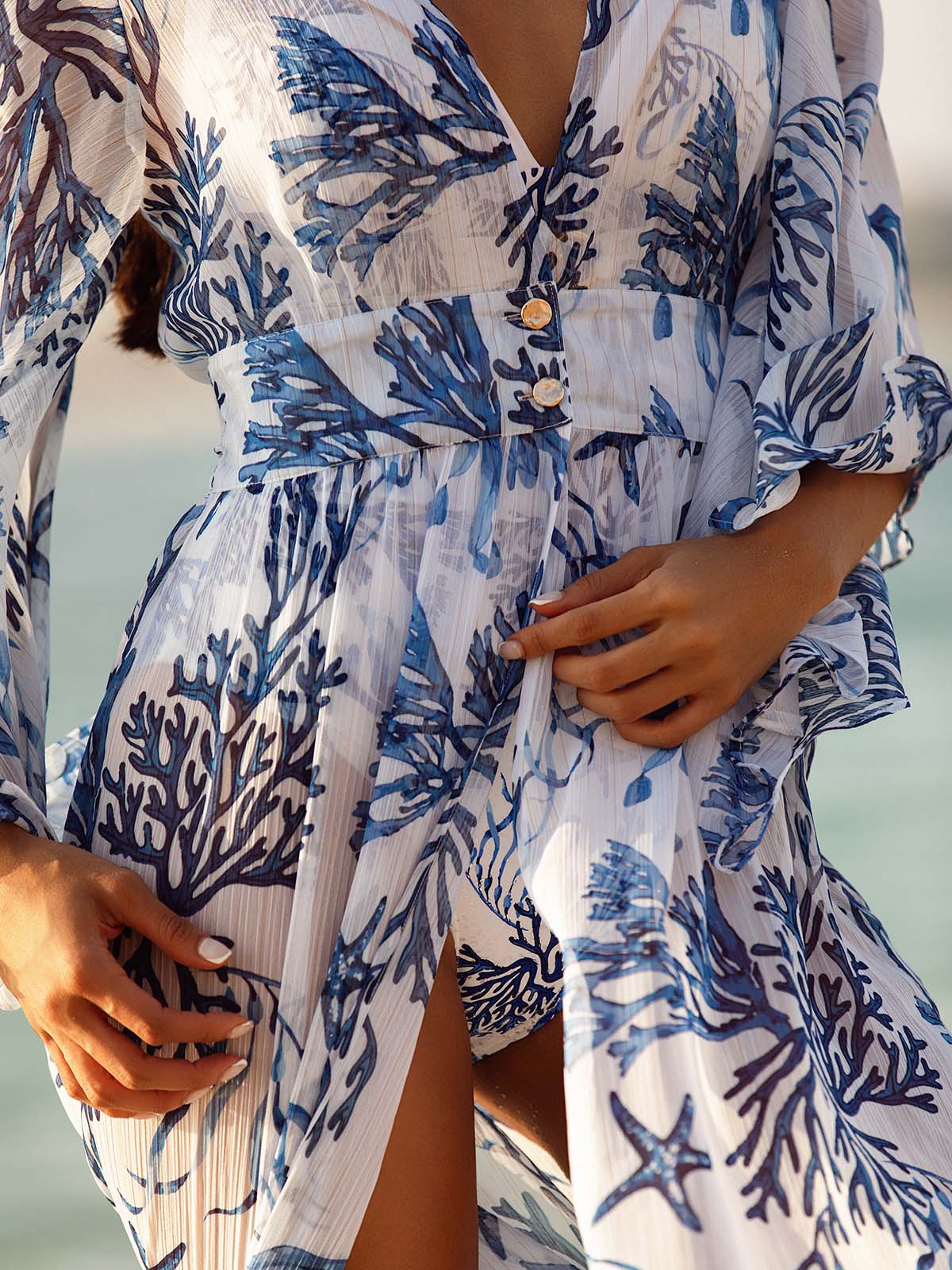 Model wearing the Barcelona Kaftan and swimsuit in La Mer print by NAIA Beach