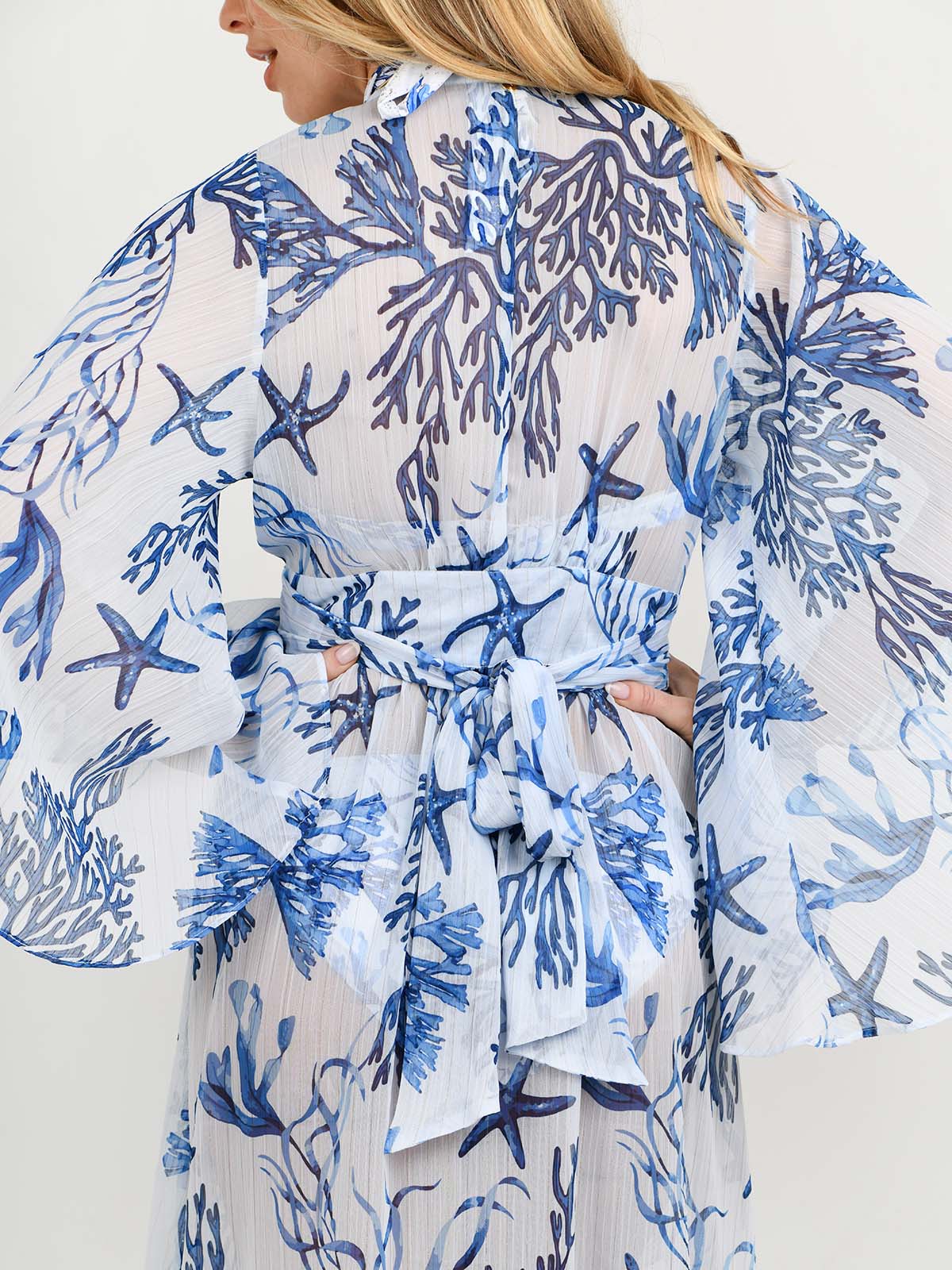 Model wearing the Barcelona Kaftan and swimsuit in La Mer print by NAIA Beach