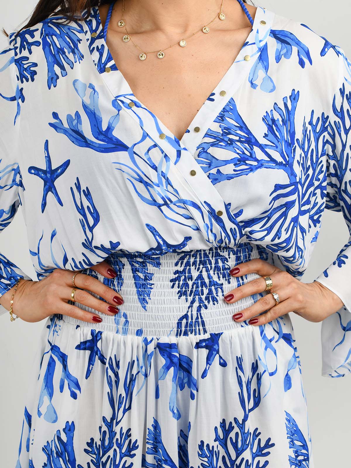 Model wearing the Celia dress in La Mer print by NAIA Beach
