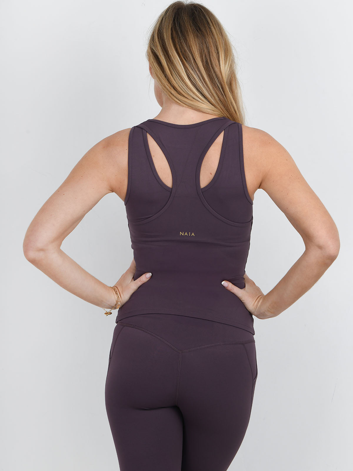 Simone Tipped Vest in Fig colour from NAIA active - active wear collection worn with the simone tipped legging