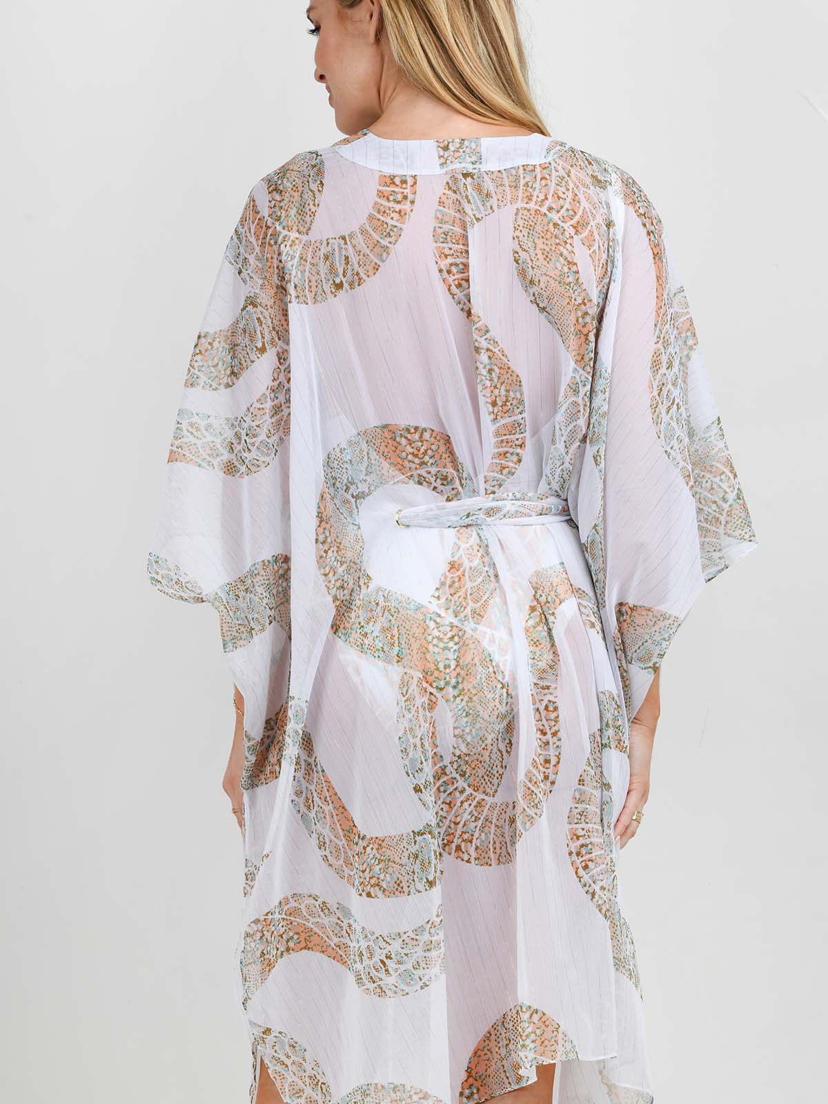 Model wearing the Ibiza Snake swimsuit and kaftan by NAIA Beach 