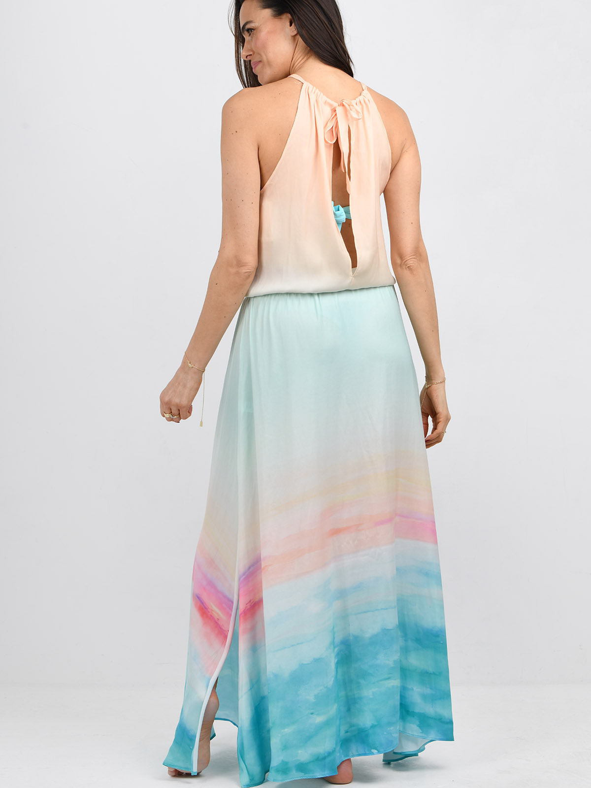 Model wearing the Pelosa dress in golden hour ocean  by NAIA Beach